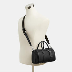 Coach Men's Compass Bag 25, premium leather travel bag with elegant leather trim and practical layout.