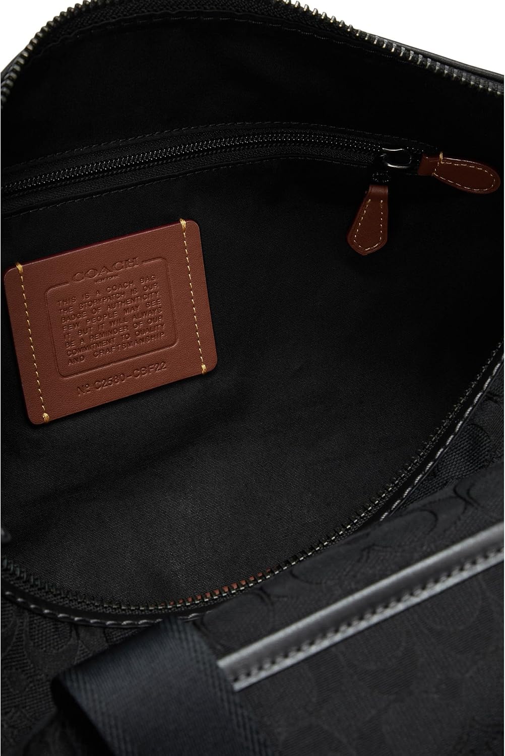 Coach Theo Duffle Premium Signature Jacquard black, elegant luggage for business and leisure.