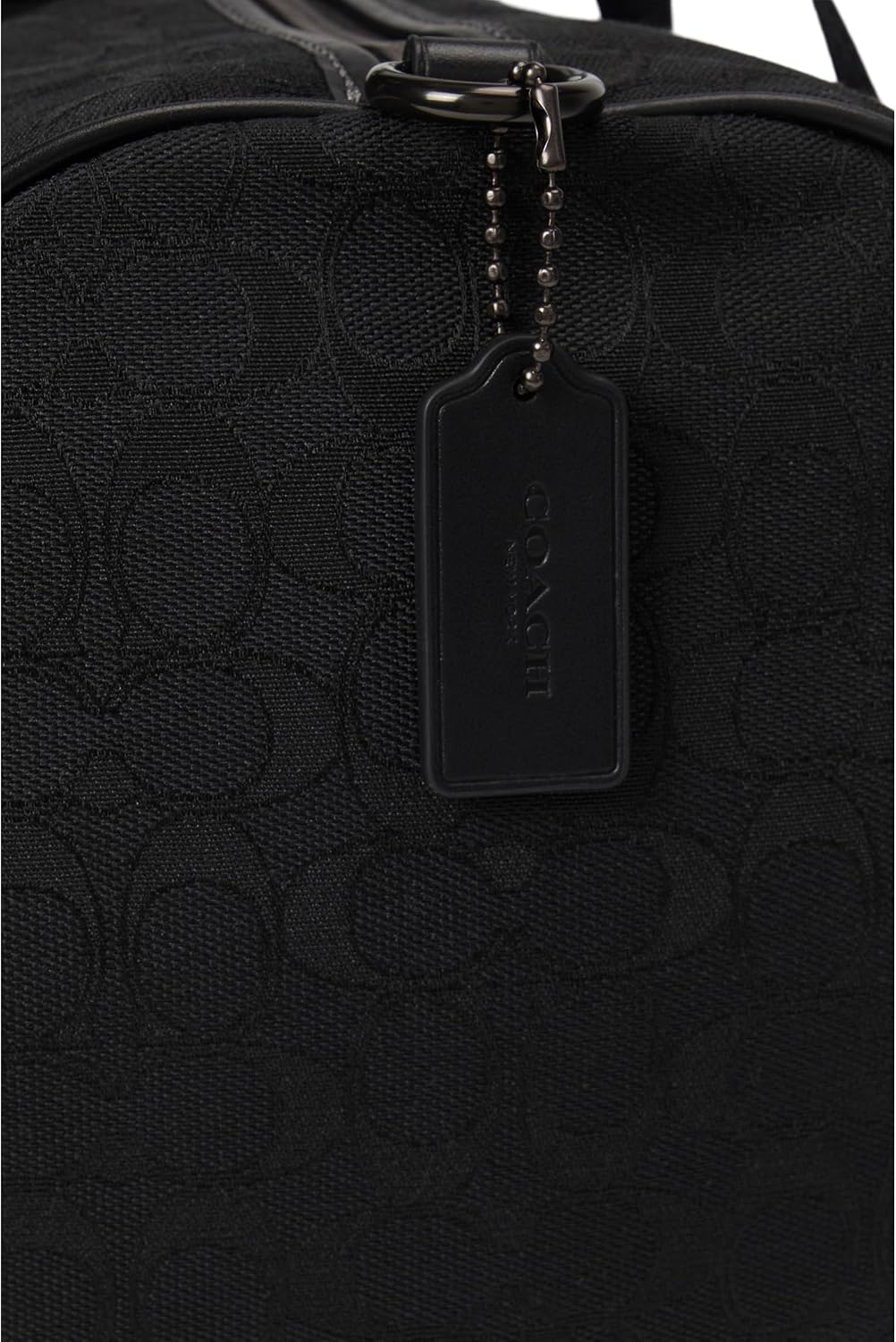 Coach Theo Duffle Premium Signature Jacquard black, refined travel tote with secure compartments.